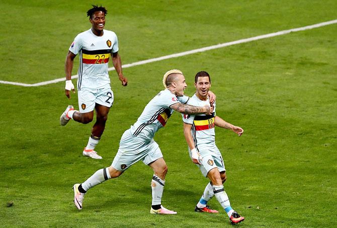 Belgium's Eden Hazard (right) celebrates with teammates Michy Batshuayi (left) and Radja Nainggolan (centre) after scoring his team's third goal against Hungary during their Euro round of 16 match at Stadium Municipal in Toulouse on Sunday