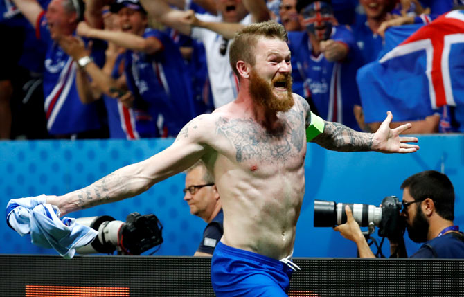 Iceland's Aron Gunnarsson celebrates winning the Euro 2016 round of 16 match against England on June 27