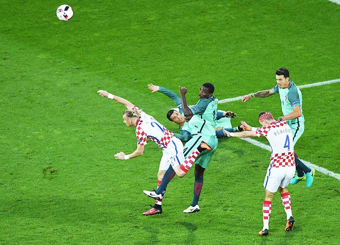Portugal and Croatia players get into a tangle as they vie for possession during their Euro 2016 round of 16 match at Stade Bollaert-Delelis in Lens on Saturday
