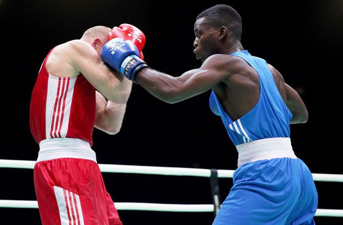 Peter Mullenberg of the Netherlands (red) fights Joshua Senna Kwesi Buatsi of Great Britain in the Men's Light Heavy (81 kg) class during the International Boxing Tournament - Aquece Rio Test Event for the Rio 2016 Olympics at RioCentro in December 2015