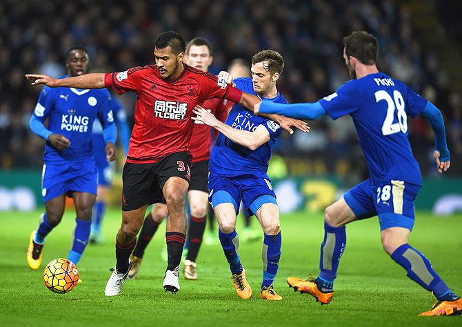 West Bromwich Albion's Salomon Rondon is challenged by Leicester City's Andy King as they vie for possession