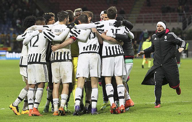 The players of the Juventus FC celebrate a victory at the end of the TIM Cup match between FC Internazionale Milano and Juventus FC at Stadio Giuseppe Meazza