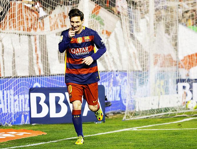 FC Barcelona's Lionel Messi celebrates after netting a goal against Rayo Vallecano during their La Liga match at Estadio de Vallecas in Madrid on Thursday