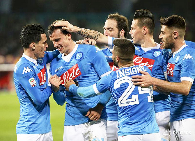 Napoli's Vlad Iulian Chiriches (2nd from left) celebrates with his teammates after scoring against Chievo Verona in San Paolo Stadium, Naples on Saturday