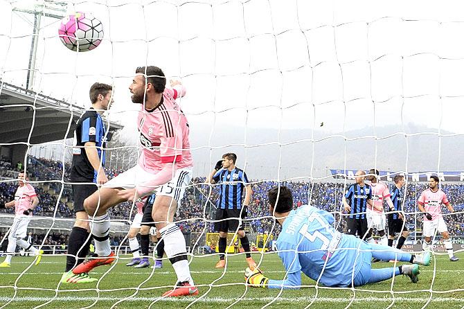 Juventus' Andrea Barzagli (15) shoots to score the first goal against Atalanta during their Serie A match at the Atleti Azzurri d'Italia Stadium, Bergamo, on Sunday