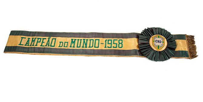 A yellow and green satin sash with a gold bullion fringe presented to Pele by the Brazilian Sport Confederation (CBD) to commemorate Brazil's legendary 1958 FIFA World Cup victory is shown in this handout photo released on March 8, 2016