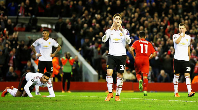 Manchester United's Gullermo Varela and teammates look dejected after Roberto Firmino scored the second goal for Liverpool during their UEFA Europa League Round of 16, first Leg match at Anfield on Thursday