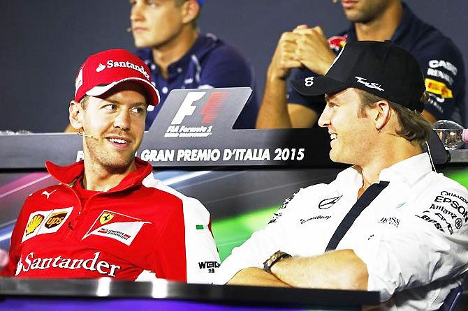 Ferrari's Sebastian Vettel and Mercedes' Nico Rosberg during a press conference
