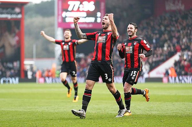 Bournemouth's Steve Cook celebrates scoring the third goal against Swansea City