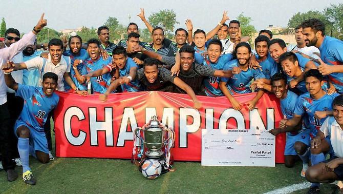 Services players celebrate with Santosh Trophy after beating Maharashtra 2-1 in the final at Nagpur 