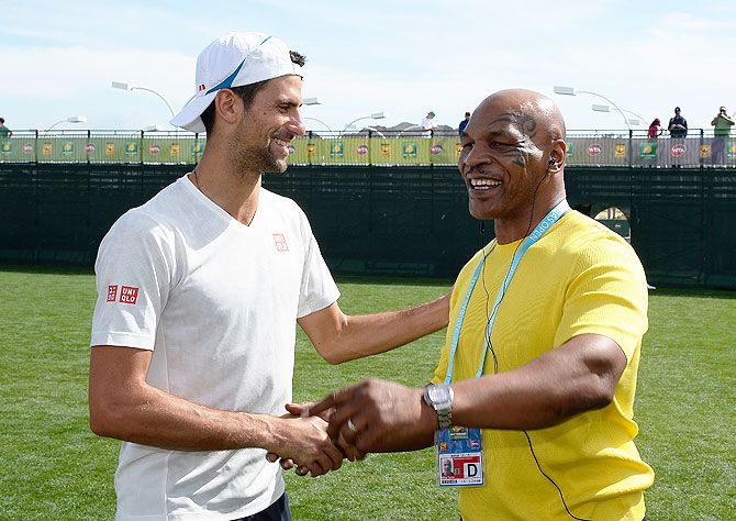 Serbia's Novak Djokovic meets Mike Tyson during day seven of the BNP Paribas Open at Indian Wells Tennis Garden in Indian Wells, California, on Sunday