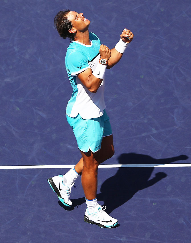 Rafael Nadal of Spain celebrates defeating Kei Nishikori of Japan during day twelve of the BNP Paribas Open at Indian Wells Tennis Garden