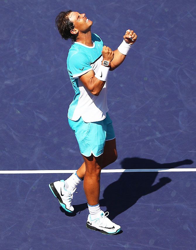 Rafael Nadal of Spain celebrates defeating Kei Nishikori of Japan during day twelve of the BNP Paribas Open at Indian Wells Tennis Garden