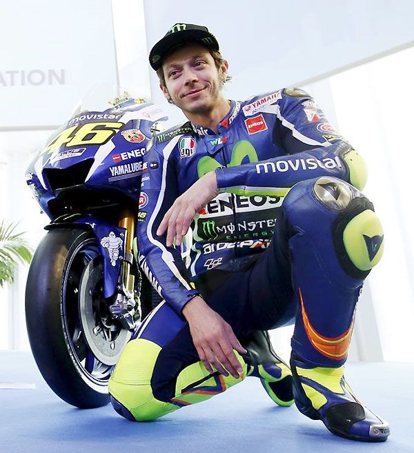 Yamaha's MotoGP rider Valentino Rossi poses with the new Yamaha YZR-M1 for the 2016 season in Barcelona