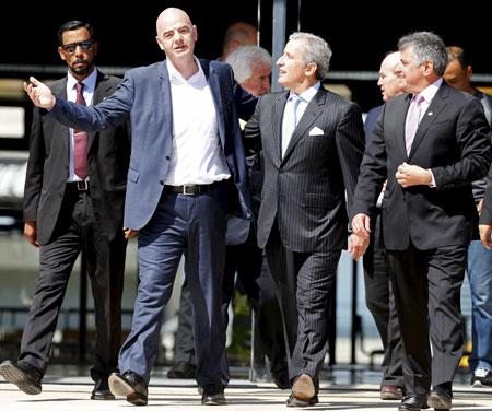 Fifa's President Gianni Infantino gestures alongside President of Uruguay's soccer club Penarol Juan Pedro Damiani and President of the Uruguayan Football Association (AUF) Wilmar Valdez during his visit to Penarol's stadium Campeon del Siglo in Montevideo, Uruguay on Tuesday