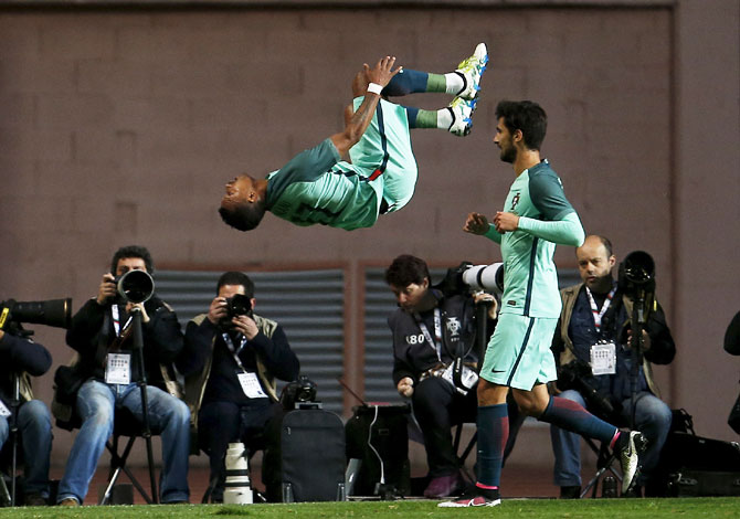 Portugal's Nani (L) celebrates his goal against Belgium