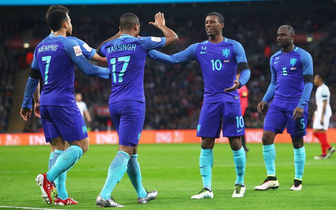 The Netherlands' Luciano Narsingh (2nd from left) celebrates scoring the winner with teammates Memphis Depay (left) and Georginio Wijnaldum during their international friendly against England at Wembley Stadium in London