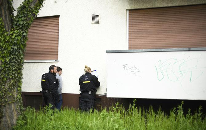 Police forces take the ID of an Eintracht Frankfurt fan while escorting fans through the city centre during the the Bundesliga Match of SV Darmstadt 98 and Eintracht Frankfurt at 'Merck-Stadion am Boellernfalltor' in Darmstadt, Germany on Saturday. The city of Darmstadt ordered a ban on fans of Eintracht Frankfurt entering the city for 36 hours, which has now been overturned