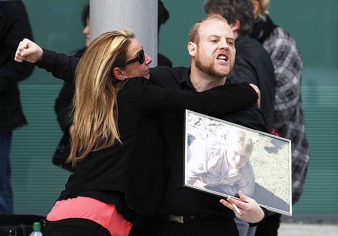 Relatives react after the jury delivered its verdict at the new inquests into the Hillsborough disaster, in Warrington on Tuesday, April 26