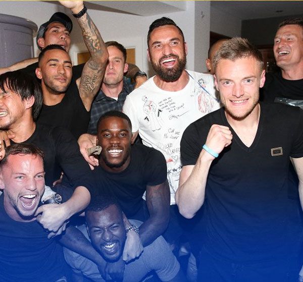 Leicester players Leonardo Ulloa, Marcin Wasilewski, Jamie Vardy and others celebrate after Chelsea and Tottenham played out a draw and confirm the Foxes as champions on Monday