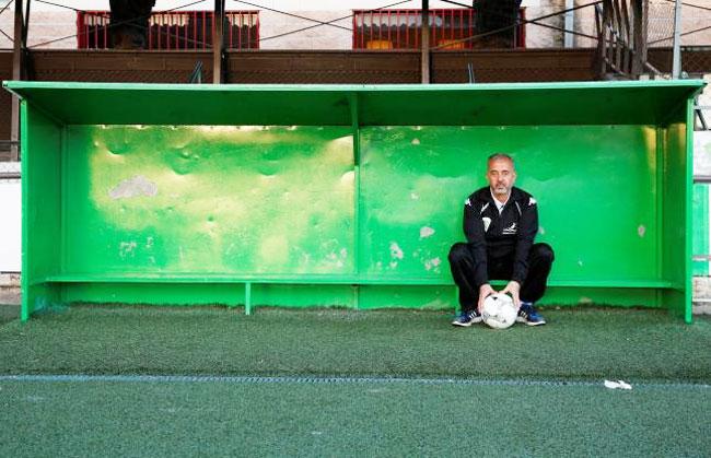 Osama Abdul Mohsen, a Syrian refugee, poses for a photograph after a training session with his junior team in Villaverde, a neighbourhood in Madrid