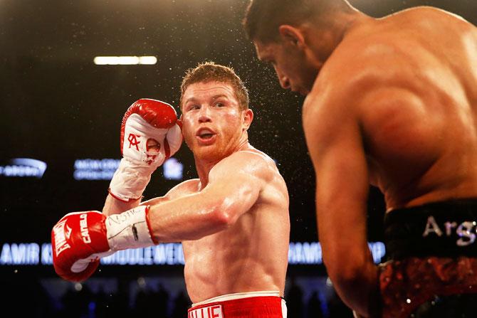 Canelo Alvarez throws a left at Amir Khan