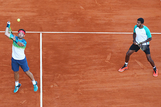 Romania's Florin Mergea and his doubles partner India's Rohan Bopanna (right) in action