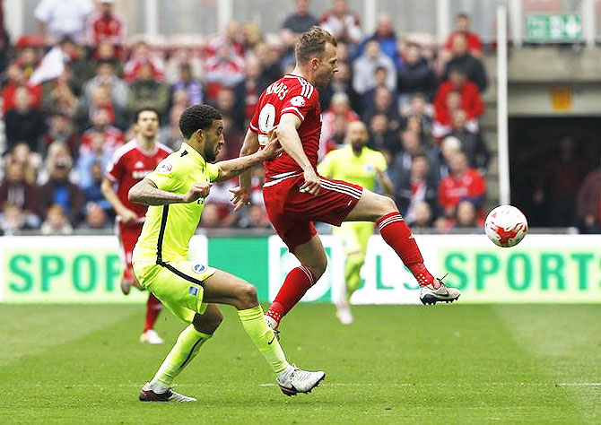 Middlesbrough's Jordan Rhodes and Brighton's Connor Goldson vie for possession