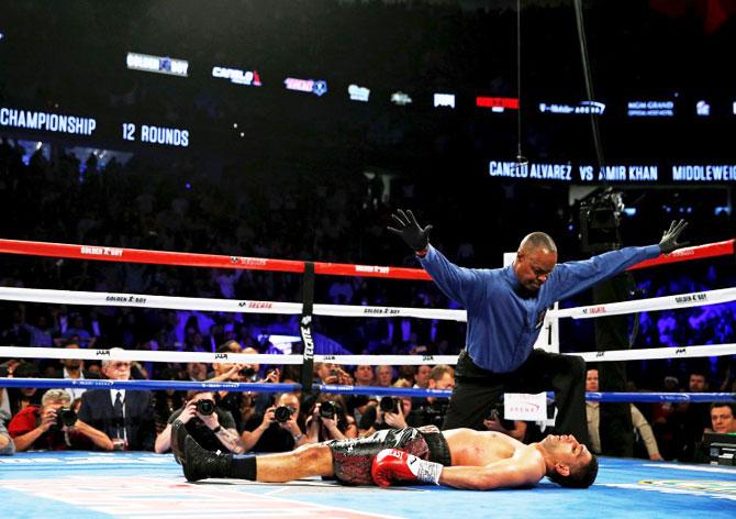 The referee declares the fight over after Amir Khan is knocked down by Saul Canelo Alvarez during their WBC middleweight title fight at T-Mobile Arena in Las Vegas on Saturday