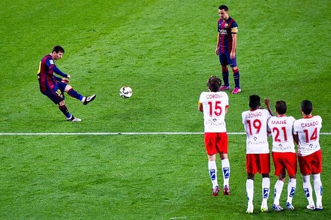 Barcelona’s Lionel Messi takes a free-kick 