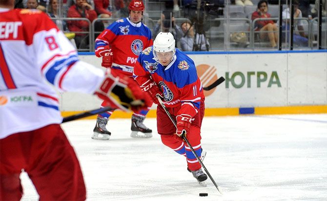 Russian President Vladimir Putin in action during a gala game of the Night Ice Hockey League in Sochi, Russia, on Tuesday