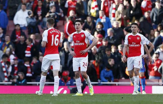 Arsenal's Hector Bellerin, Aaron Ramsey and Gabriel Paulista look dejected after a game