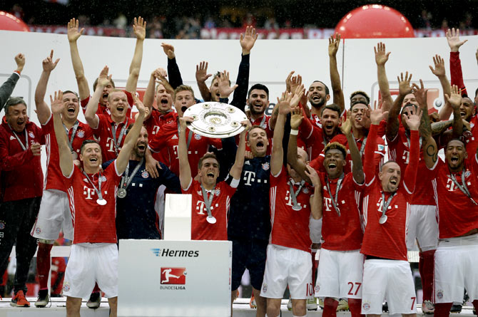 PHOTOS: Bayern celebrate Bundesliga title, Stuttgart relegated - Rediff Sports