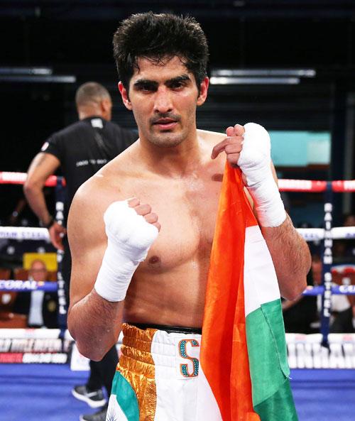 Vijender Singh celebrates after the bout