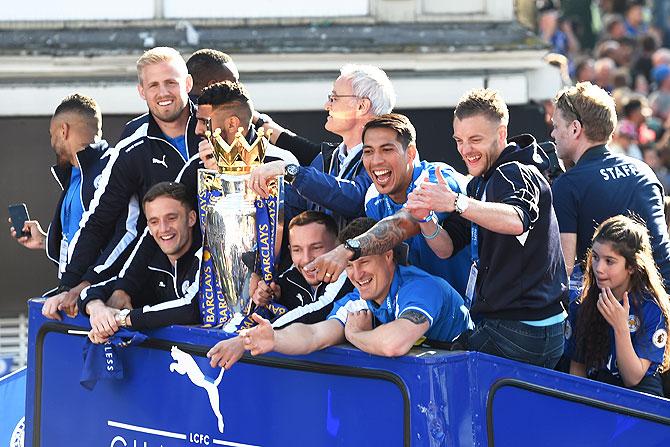  The Buses carrying the Leicester squad and trophy make their way through the the streets during the Leicester City Barclays Premier League winners bus parade on Monday