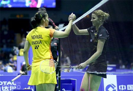 India's Saina Nehwal is congratulated by her opponent