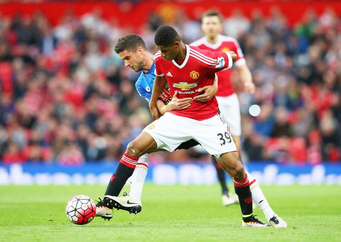 Manchester United's Marcus Rashford holds off Bournemouth's Andrew Surman