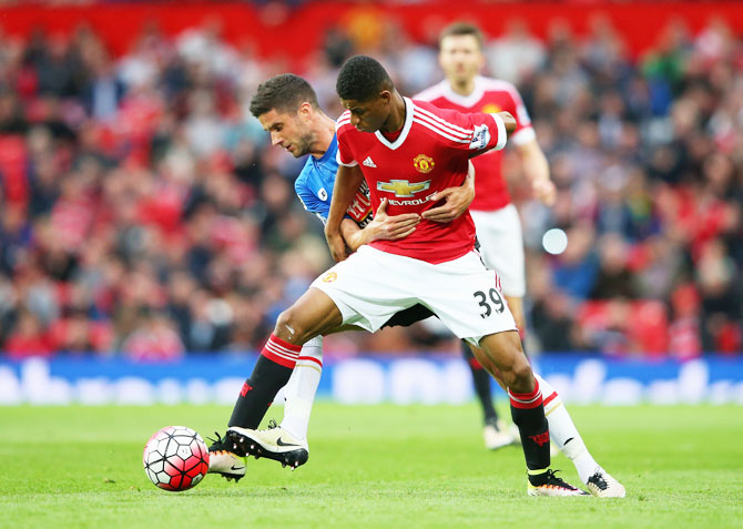 Manchester United's Marcus Rashford holds off Bournemouth's Andrew Surman