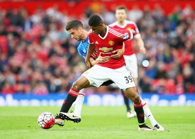 Manchester United's Marcus Rashford holds off Bournemouth's Andrew Surman