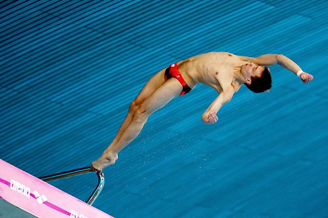 Viktor Minibaev of Russia competes in the Men's 10m Platform Final on May 15