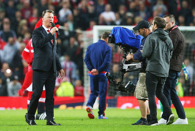 Manchester United manager Louis van Gaal speaks to the crowd after the Barclays Premier League match against AFC Bournemouth at Old Trafford in Manchester on Tuesday