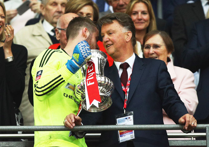 Manchester United's David De Gea and manager Louis van Gaal after winning The FA Cup Final on Saturday