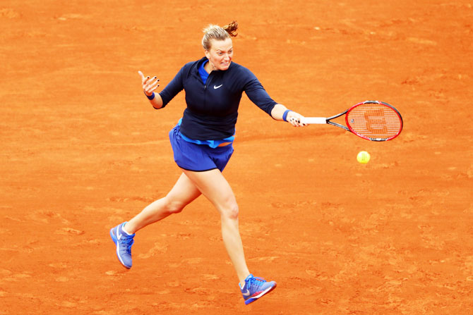 Czech Republic's Petra Kvitova hits a forehand against Montenegro's Danka Kovinic during their first round match