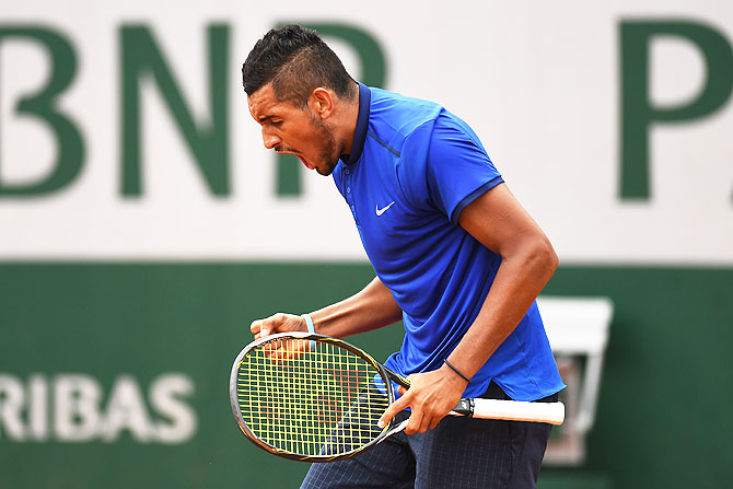 Australia's Nick Kyrgios reacts during his men's singles first round match against Italy's Marco Cecchinato at the 2016 French Open at Roland Garros in Paris, on Sunday