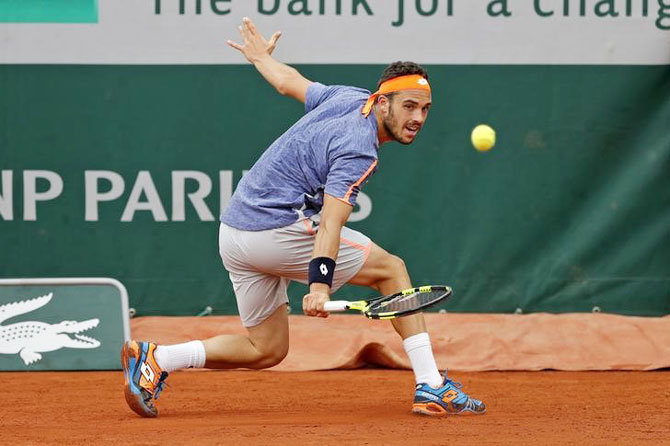 Marco Cecchinato returns the ball