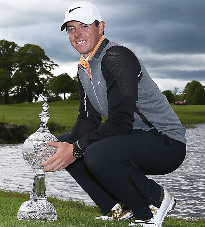 Rory McIlroy of Northern Ireland poses with the Duty Free Irish Open trophy last montj