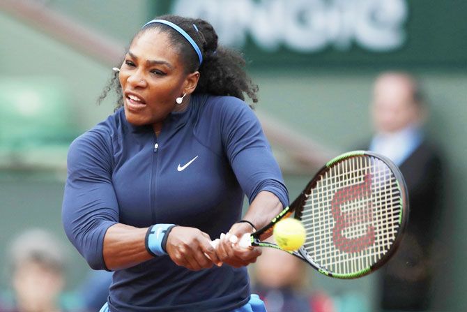 USA's Serena Williams plays a return during her first round match against Slovakia's Magdalena Rybarikova on Tuesday