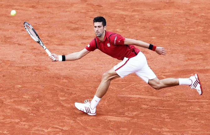 Novak Djokovic returns a shot