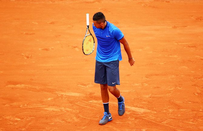 A dejected Nick Kyrgios reacts during his French Open third round match against Richard Gasquet at Roland Garros on Friday
