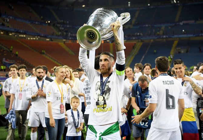 Real Madrid's Sergio Ramos lifts the Champions League trophy after winning the UEFA Champions League on Saturday